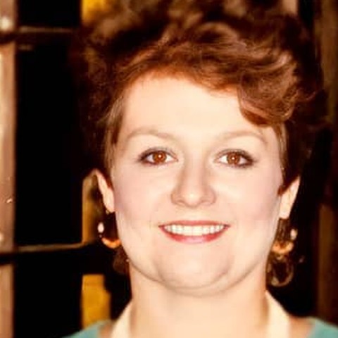 Becky Quessenberry Farmer holding the Irish Cup